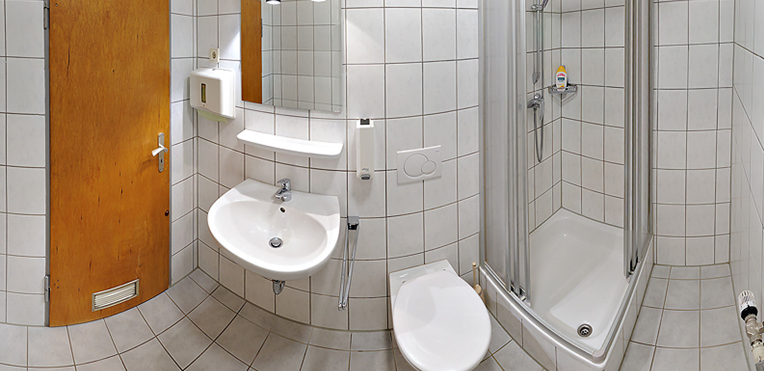 Bright tiled bathroom with shower